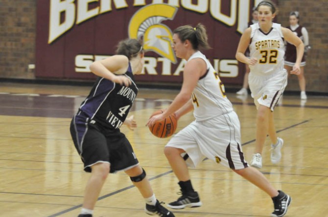 Danielle Wickre takes the ball down the court in first quarter action